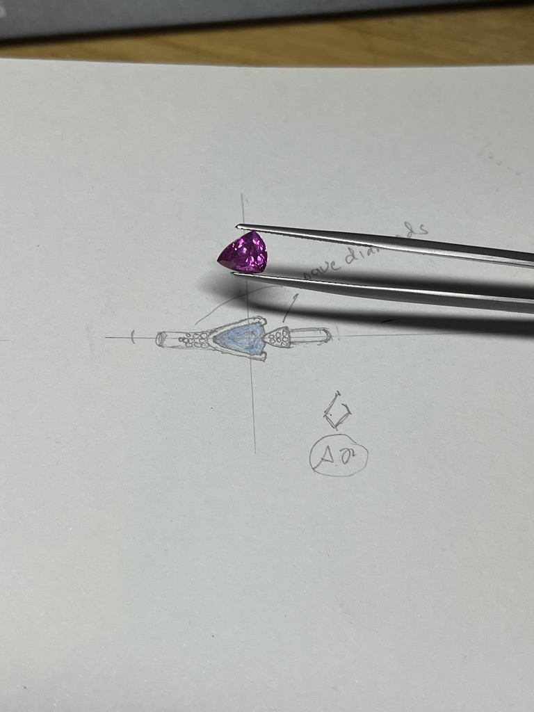 sketch with pink or blue trilliant sapphire